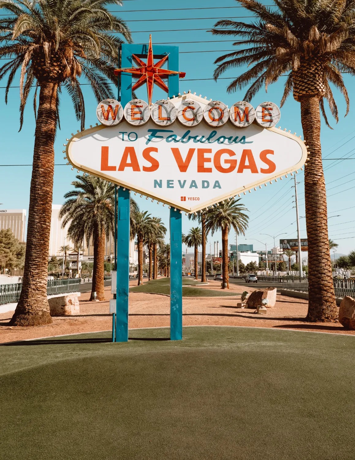 The Welcome to Fabulous Las Vegas sign framed by palm trees